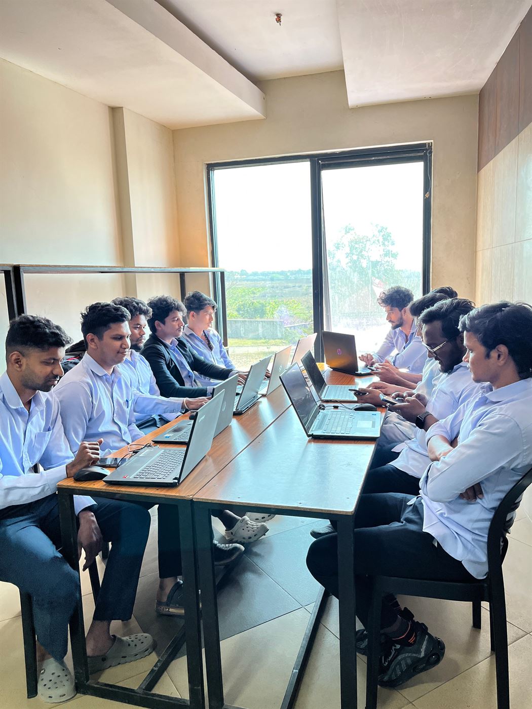 Interns working on laptops